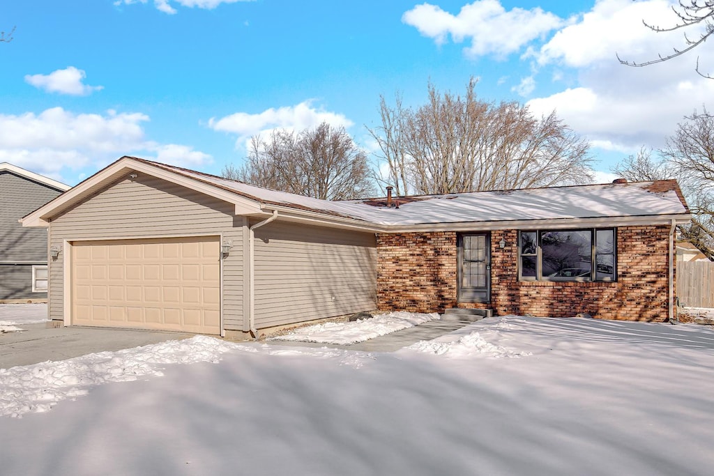 single story home featuring a garage