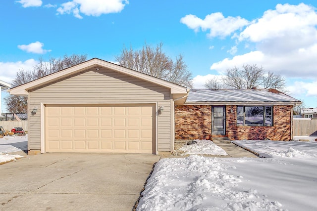 ranch-style house featuring a garage