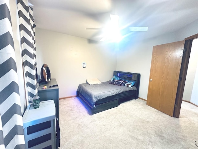 bedroom with light colored carpet and ceiling fan