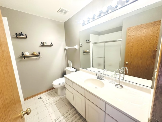 bathroom featuring toilet, tile patterned flooring, an enclosed shower, and vanity