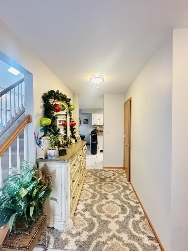 hall featuring light tile patterned floors