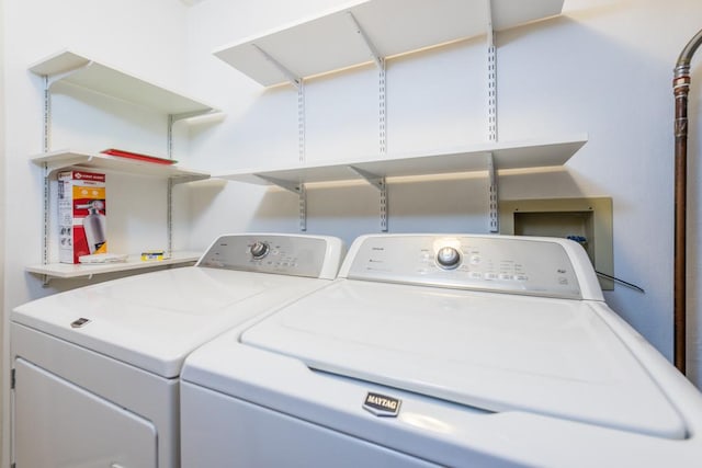 laundry area with washing machine and dryer