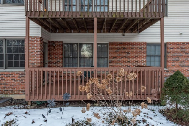 exterior space featuring a balcony and a wooden deck