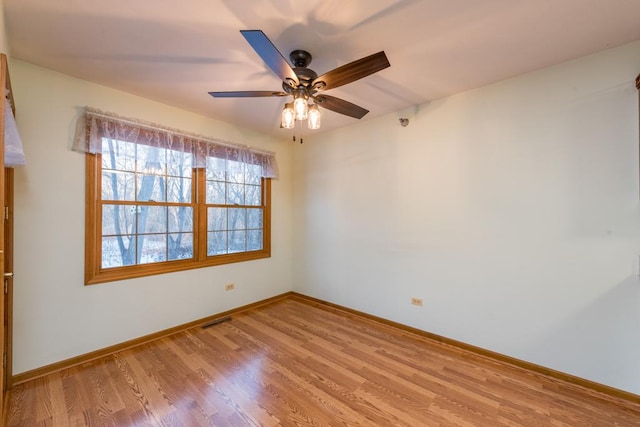 spare room featuring ceiling fan and light hardwood / wood-style flooring