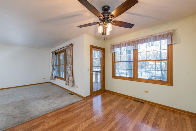 spare room featuring ceiling fan and hardwood / wood-style floors