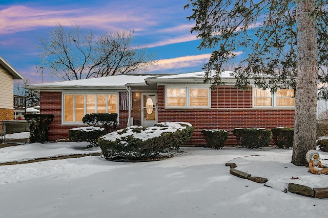 view of front of home featuring brick siding