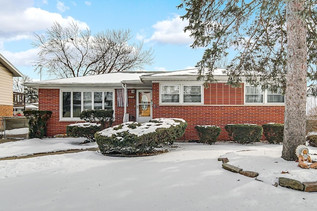 view of front of property featuring brick siding