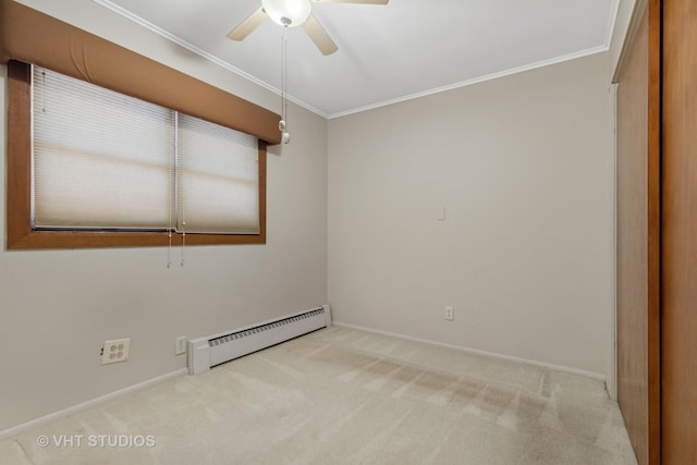 unfurnished room featuring baseboard heating, ceiling fan, crown molding, and light carpet