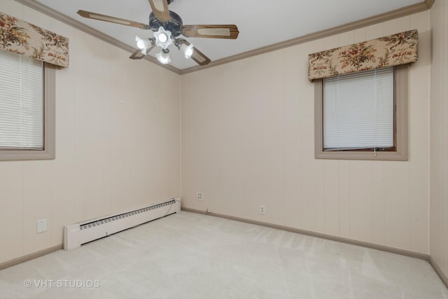 spare room with crown molding, a baseboard heating unit, light colored carpet, and ceiling fan