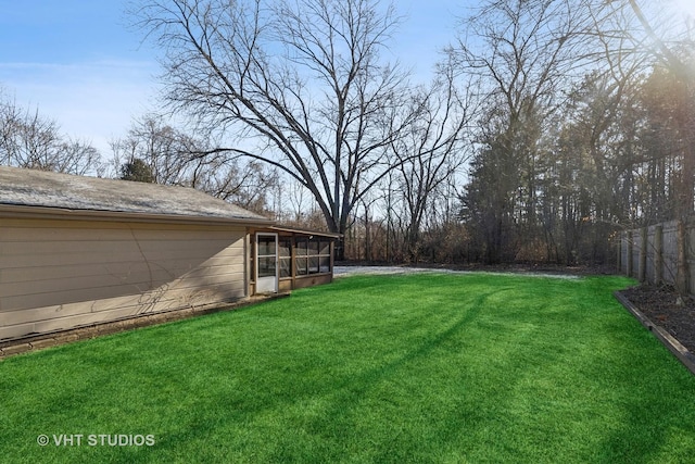 view of yard with a sunroom