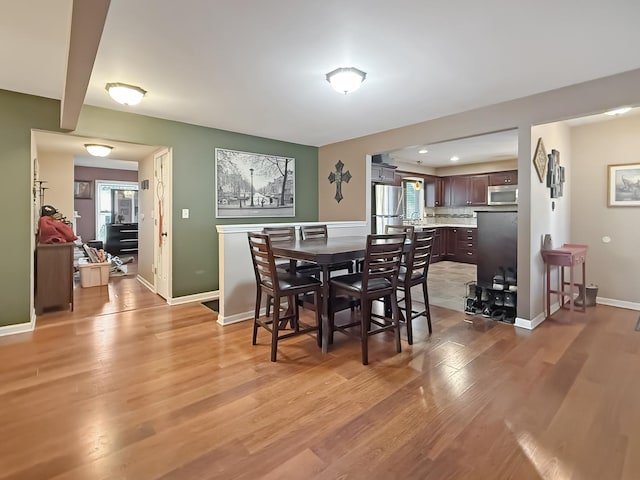 dining room with hardwood / wood-style floors and plenty of natural light