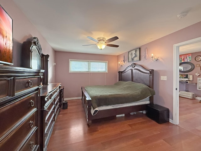 bedroom with ceiling fan and wood-type flooring