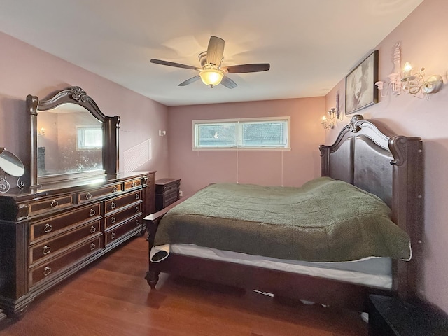 bedroom featuring ceiling fan and dark hardwood / wood-style floors