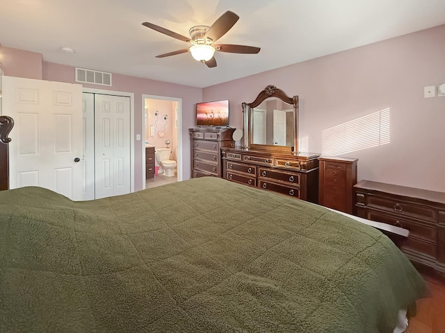 bedroom featuring ensuite bathroom, ceiling fan, and a closet