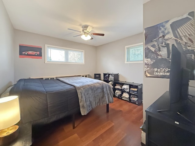 bedroom featuring hardwood / wood-style floors and ceiling fan