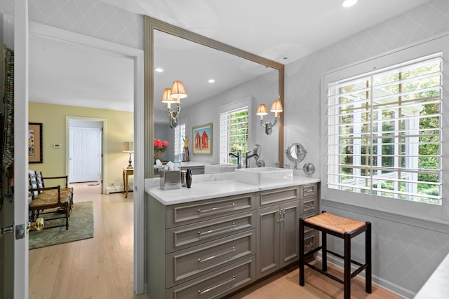 bathroom featuring vanity, recessed lighting, and wood finished floors