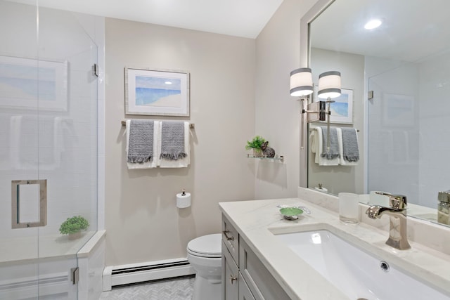 bathroom with a shower stall, vanity, toilet, and a baseboard heating unit