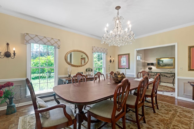 dining space featuring baseboards, an inviting chandelier, and ornamental molding