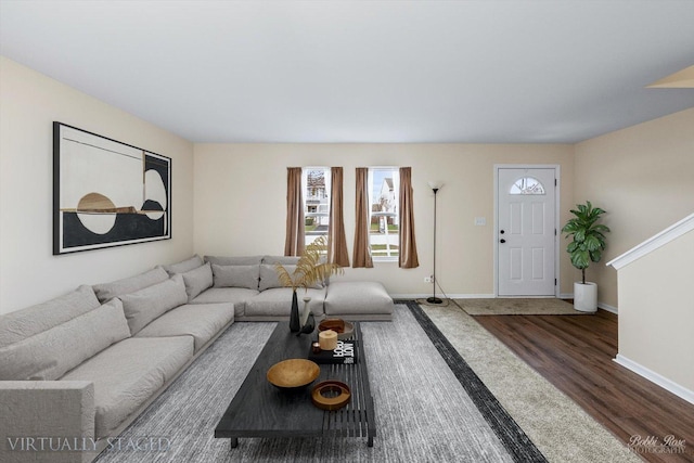 living room with dark hardwood / wood-style flooring