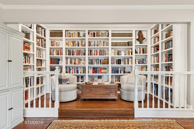 sitting room with ornamental molding and dark hardwood / wood-style floors