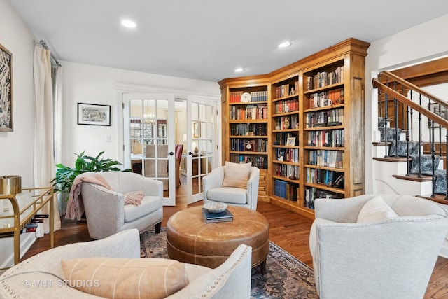 living area featuring hardwood / wood-style flooring and french doors