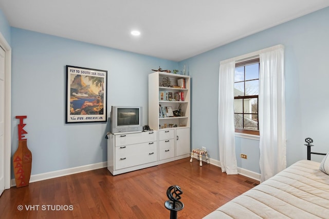 bedroom featuring dark hardwood / wood-style floors