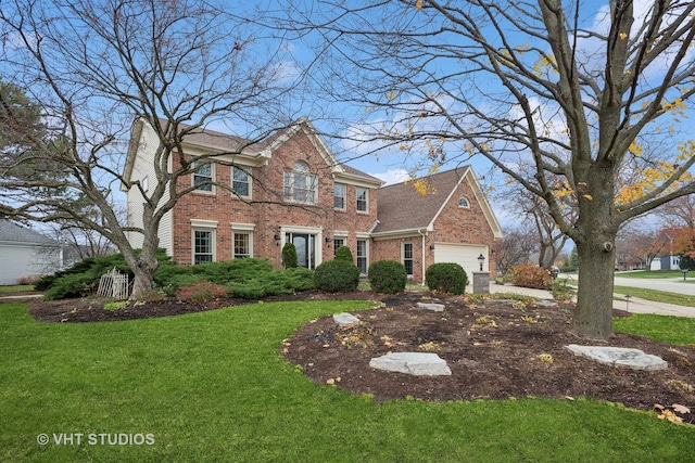 view of front of house featuring a garage and a front lawn