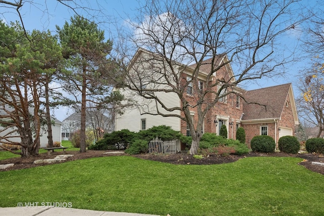 view of front of house with a garage and a front yard