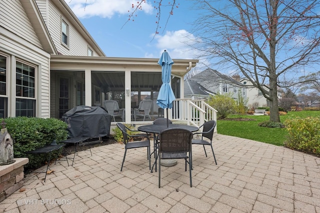 view of patio with a sunroom and grilling area