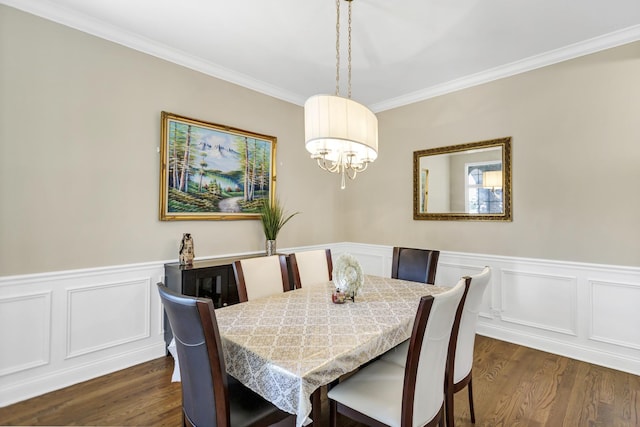 dining area with an inviting chandelier, crown molding, and dark hardwood / wood-style floors