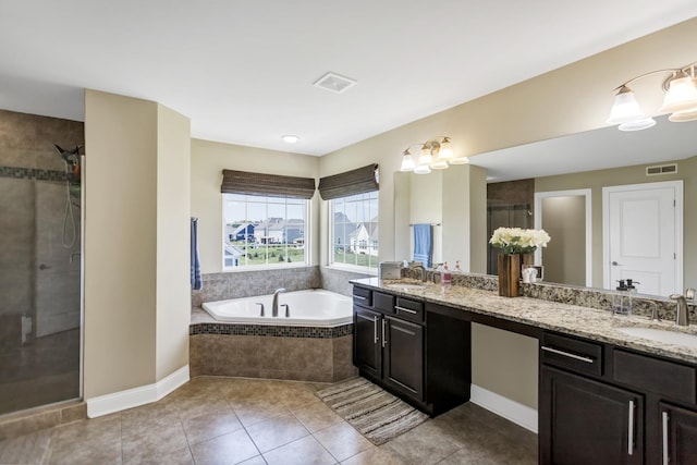 bathroom featuring vanity, tile patterned floors, and separate shower and tub