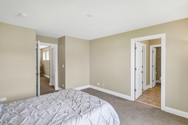 bedroom with light colored carpet