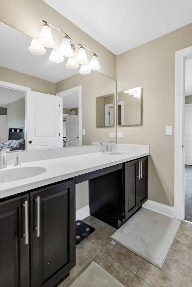 bathroom with tile patterned flooring and vanity