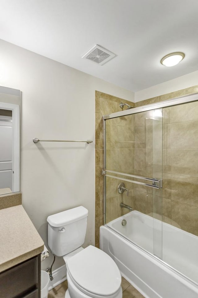 full bathroom with toilet, enclosed tub / shower combo, and vanity