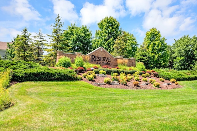 community sign featuring a lawn