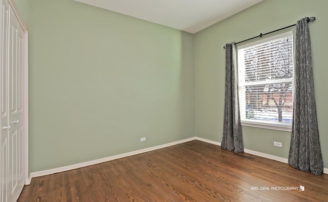 empty room with hardwood / wood-style floors