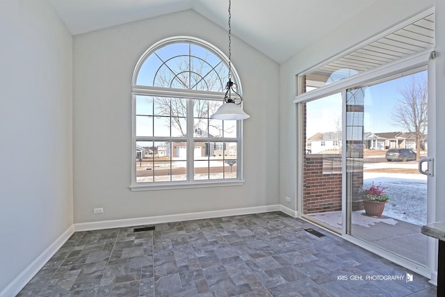 interior space with vaulted ceiling and plenty of natural light