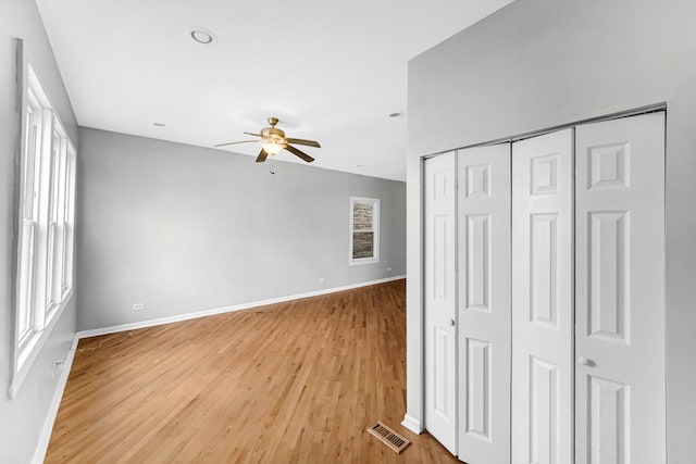 interior space with ceiling fan, light hardwood / wood-style floors, and a wealth of natural light