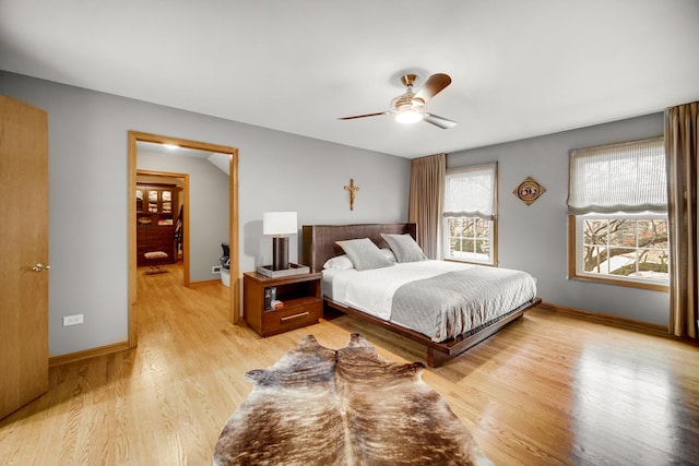 bedroom with light hardwood / wood-style flooring and ceiling fan