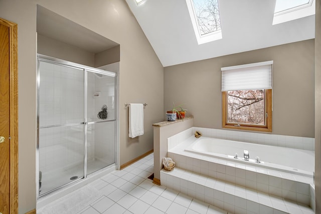 bathroom with tile patterned floors, vaulted ceiling with skylight, and shower with separate bathtub