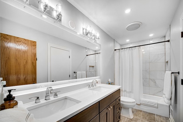 bathroom featuring vanity, curtained shower, and toilet