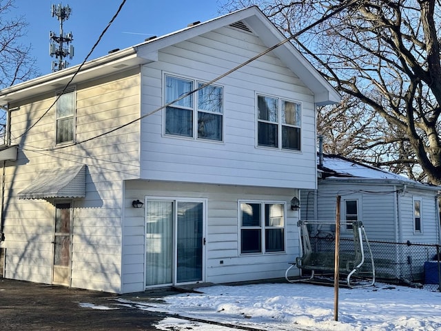 view of snow covered house