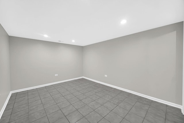 spare room featuring tile patterned flooring