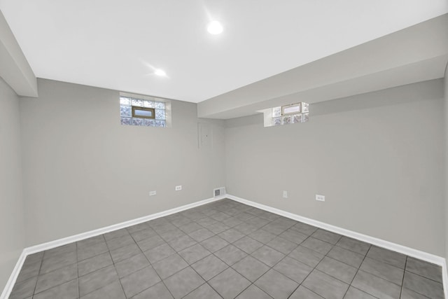 basement featuring tile patterned floors