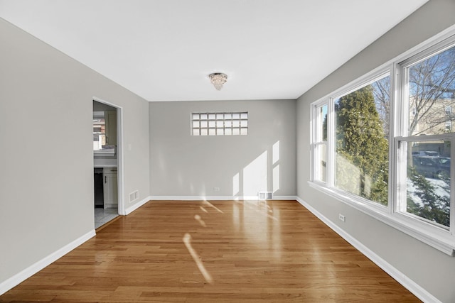 empty room featuring hardwood / wood-style floors