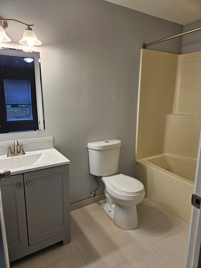 full bathroom featuring shower / tub combination, vanity, and toilet