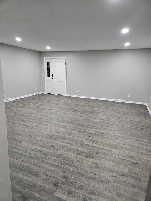 spare room with dark wood-type flooring