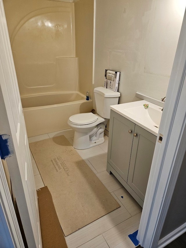 full bathroom with toilet, shower / bath combination, tile patterned floors, and vanity