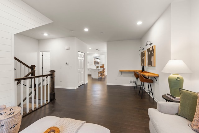 living room featuring dark hardwood / wood-style floors