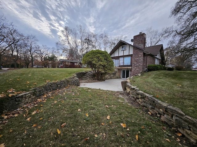 exterior space featuring a patio area and a yard